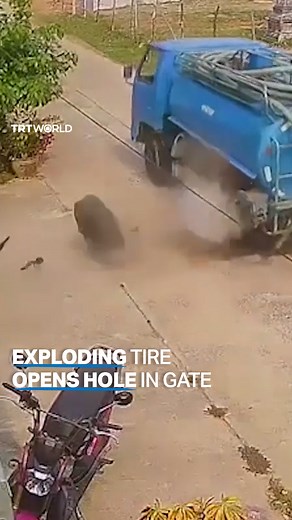 166K views · 593 reactions | The tire of a vacuum truck explodes as the vehicle drives down a residential street, crashing into one of the panels of a gate in Thailand's Surin province. There were no reported injuries. | TRT World | Facebook