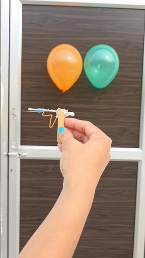 Turn a cotton swab, a spring, and a popsicle stick into the coolest mini launcher ever