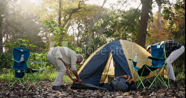 Father, son and camping with tent in forest, nature and bonding for holiday or weekend break. Woods, teamwork and equipment for shelter in countryside, explore or adventure in park with parent person