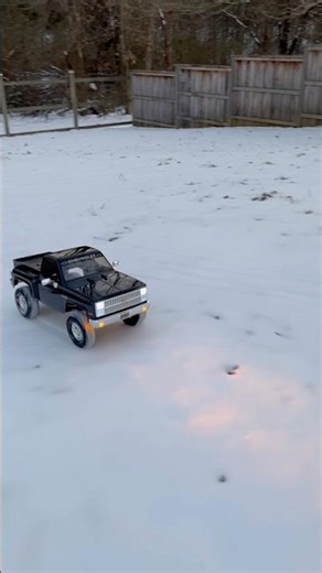 Chevy K10 cruising up a snowy slope | Axial SCX10 Basecamp Chevy K10