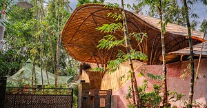 arched bamboo roof shades learning space in bali co-designed by students and mizzi studio