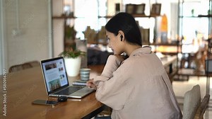 Asian girl study test computer cafe. Female student learn internet article. Woman freelancer read online news laptop. People freelance work Asia. Person use macbook prepare exam. Vlog site writer job.