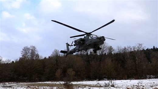 Army Apache helicopter lifts off during Germany exercise