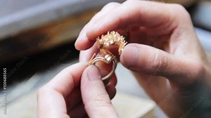 Assembly, soldering pieces of gold jewelry jeweler. Production and making manufacturing, factory, cast craft design, process precious gold jewelry, diamond, jewels, ring jeweler, goldsmith in workshop
