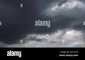 Dramatic time-lapse of dark storm clouds forming and rain approaching over the horizon. Perfect for weather-related, nature documentaries, or cinematic backgrounds Stock Video Footage - Alamy