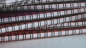 clip-1037956244-close-shot-assortment-ring-bound-books-rotating
