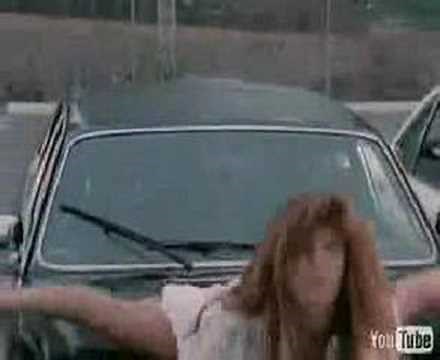 Tawny Kitaen Does the Splits on the Hood of a Car