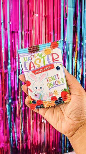 how cute is this Easter fruit snack party favor!? Would make a great DIY Easter basket stuffer. Custom fruit snack wrappers are easy to make when using mini 5x7 Party Printables Paper. Simply print borderless, wrap and seal. #prettypartyandcrafty #partyprintablespaper #easter #papercrafting #diycrafts | Pretty Party & Crafty