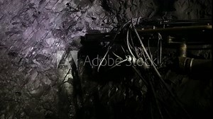 The process of drilling wells in an iron ore mine. Part of the technological process for mining minerals in an underground mine.