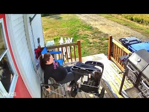 Woman Sits on Folding Lawn Chair and Falls Through the Fabric