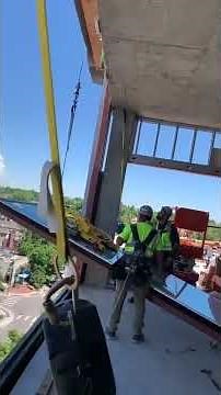 Workers Drop Heavy Glass Window Off High Rise Building - 1240028