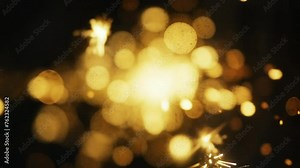 Explosion gold lights sparkles. Glowing light explodes. Flare in center, slow motion shot