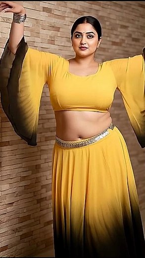 A very beautiful woman is dancing beautifully in front of the wall