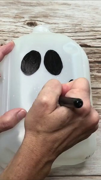 Light up your porch this Halloween with an upcycled milk jug!
