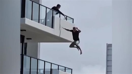 Man takes death-defying leap off balcony to avoid police