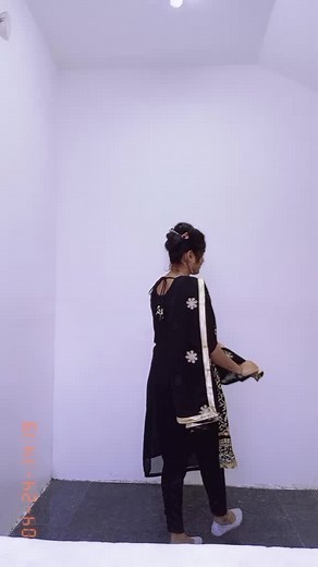 Traditional Attire Showcase: Elegant Black and Gold Outfit