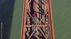 Freight Train Transporting Goods Across a Bridge For Logistics and Industry