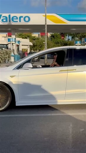 Pearl White Tesla Model X on Gold 24’s Daytons Riding