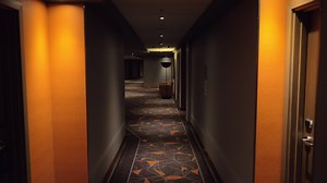 Walking in hotel hallway with dim light