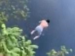Breathtaking moment daring diver jumps off 35-metre-high cliff