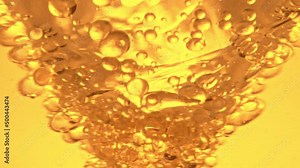 Super slow motion of splashing oil rotation. Macro abstract shot. Filmed on high speed cinema camera, 1000fps.