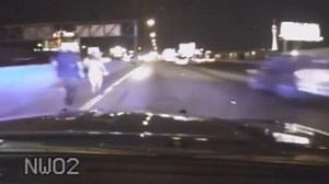 Dash Cam Video: Trooper Risks Life to Save Bikini-Clad Woman Running Across Interstate
