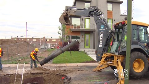 Uber driver's car crashes into giant sinkhole