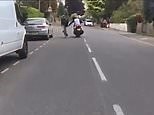 Moped gangs film each other as they pusch cyclists of their bikes
