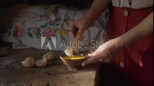 The process of beating eggs. The concept of baking craft bread.