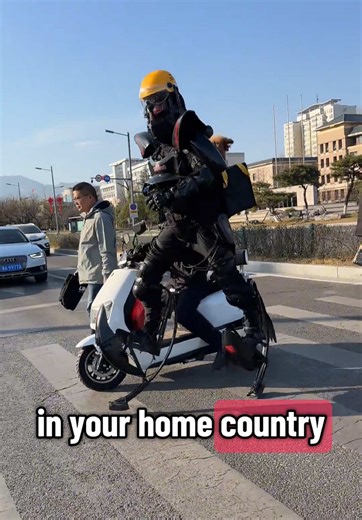 Electric-powered exoskeleton suit with spring loaded leg attachments (enhancing mobility, speed, and jumping ability). ##GaussArmor #exosuit #FutureMobility #TechMeetsLaw #PoliceInteraction #WearableTech #StreetLegalTech #InnovationOnStreet #SciFiIRL #PoweredExoskeleton #TrafficStop #NextGenTransport #TechGear #UrbanMobility #RoboticsInPublic