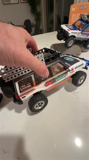 These 1/18 scale RC crawlers are packed with scale detail and legit off-road capability 🔥 The 4WD drivetrain and high-torque setup help them crawl over rocks, dirt, and tough backyard obstacles, while the dual-speed transmission lets you switch between slow technical crawling and faster trail runs. The realistic accessories, roof racks, and lighting give them that true overland adventure look, and the RTR setup means you can hit the trail right away. #RCCrawler #118Scale #RC4x4 #TrailCrawler #R