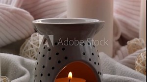 Aroma lamp with essential oil, aromatherapy at home, burning candle, dropping essential oil. Concept of home relaxation and anti stress. Natural Spa treatment Home fragnance at cozy home Generative AI