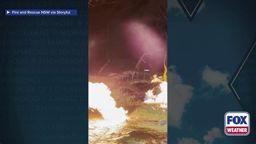 Watch: Lightning strike in New South Wales causes fire, explodes tree, ruptures gas and water main