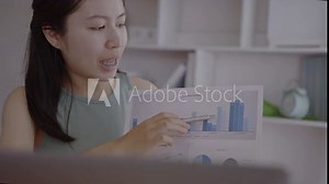 Online learning, Female student watching teacher's live performance ,Video call on laptop in classroom at home, Study at your own home.