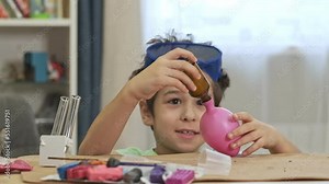 boys cientist doing experiments. Education concept. Preschooler interests. Smart little child doing chemical research at home laboratory. Dangerous experiment. Home activities for children.