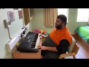 Harvey playing the piano