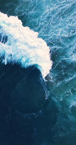 Aloha from above. Some crashing waves and ocean spray to brighten your day 🌊 ☀️. #AnywhereAloha | OluKai