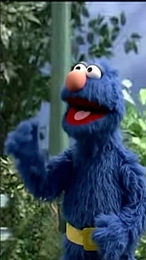 Sesame Street Grover sings to fat blue