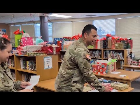 Fort Sam Houston soldiers deliver Christmas gifts to elementary school students