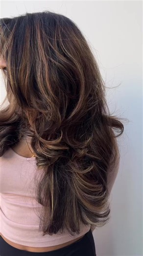 "Butterfly cut with baby bangs 曆 Haircut by moniica.styles The hair is bigger than ever 朗 we used @jbeverlyhillspro mousse and 5 in 1 lotion to lock in and give body!"  @modua_studio | Evolve Salon Systems | Facebook