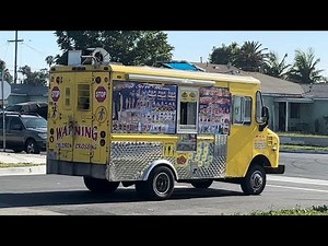 Yellow ice cream truck playing The Entertainer
