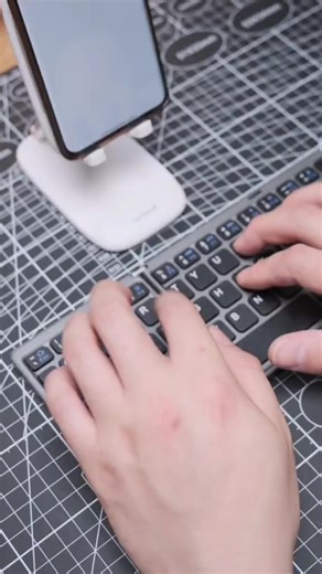 Compact Foldable Bluetooth Keyboard with Phone Stand