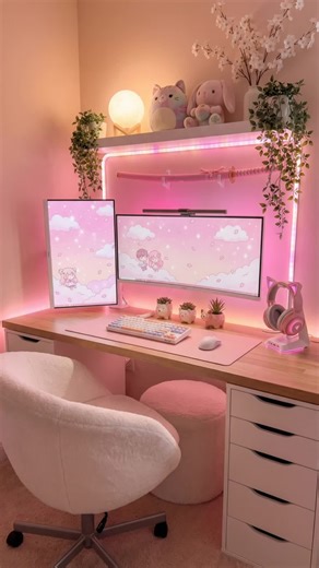 Alot.Design on Instagram: "Kawaii Pink Desk Setup With Dual Monitors and RGB Backlighting . . Cozy pink desk setup with dual monitors, soft RGB lighting, and feminine workspace decor. Kawaii gaming room inspiration with pastel accessories, plush decor, and a relaxing soft-pink aesthetic for small home offices and cozy desk vibes."