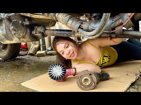 The challenge for the female mechanic: repair a broken welded sun sculpture.