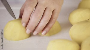 Time lapse. Step by step. Slicing Yukon gold potatoes for classic mashed potatoes