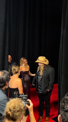 Country Now on Instagram: "@chrisstapleton and wife @morganestapleton looking good on the red carpet at the 59th @cma Awards 🤩 #cmaawards #countrymusic #chrisstapelton"
