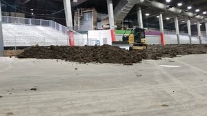 Ground level and from the Turn 3&4 Grandstands to give you and idea of how much material is already in the River Spirit Expo Center. When everything is done, crews will have hauled around 800 loads of Clay. | Chili Bowl Nationals