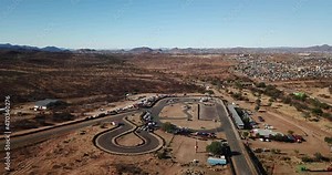 4K aerial drone video of Tony Rust racing track near Otjomuise township in Windhoek on hot sunny day, central Namibia, southern Africa