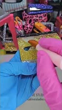 Now it is time to add a layer of uv resin to the glitter pencil themed pop up note dispenser so that