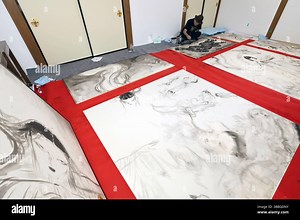 Japanese artist, character designer, and illustrator, Yoshitaka AMANO, produces decorative paintings on sliding doors and walls at Fushimi Inari Taisha Shrine in Kyoto City, Japan, on May 16, 2025, to get them blessed at the shrine on May 18. The 73-year-old artist will complete a total of 17 monochrome works titled "INARI," which are drawn with India ink, including a goddess, a dragon, and others. AMANO is famous for character designs of the popular video game series, "Final Fantasy," and the a